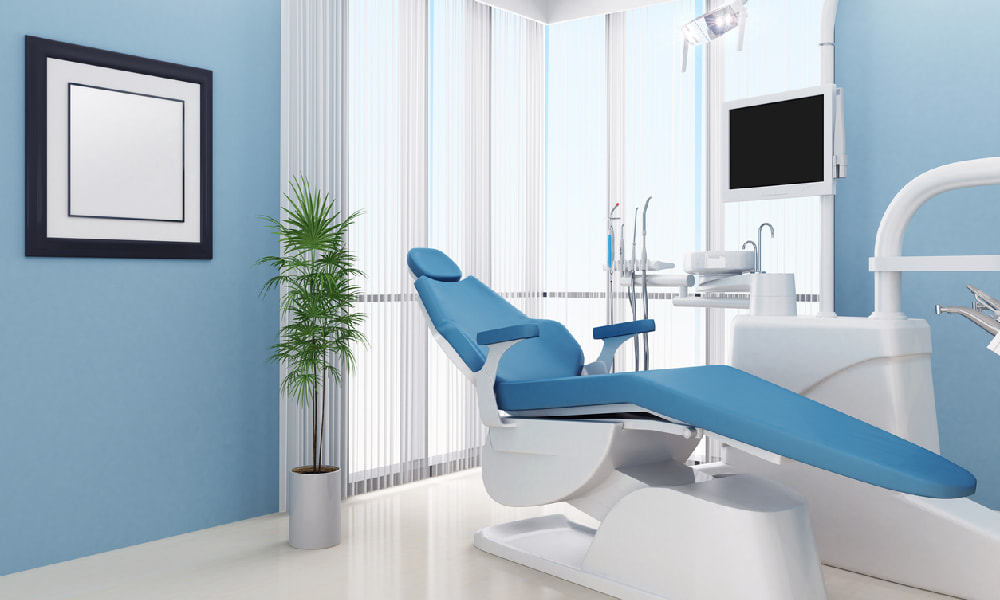 Calming blue paint with plants, artwork, and furniture highlight some good ideas for a dental office decorating approach.